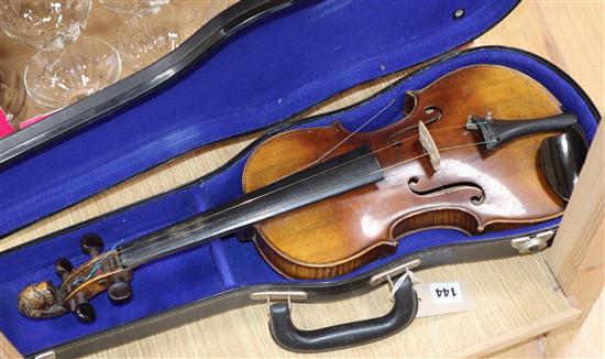 A German 19th century violin with two-piece back, faux Guadagnini label and carved lions head terminal, cased